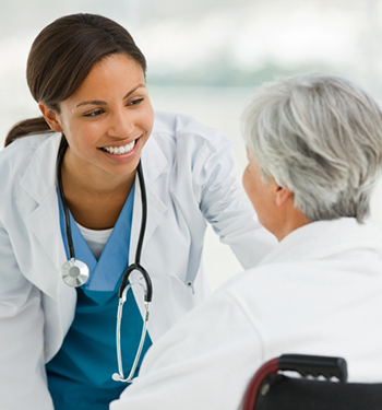 A doctor and nurse talking to each other.